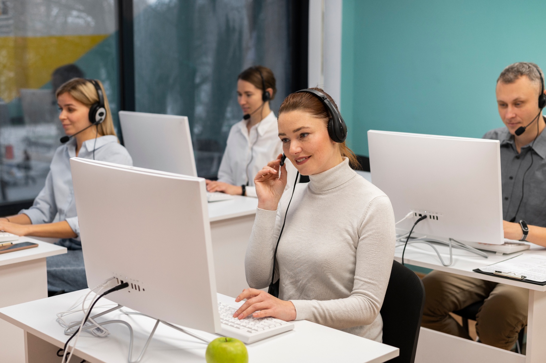 Support team at workstations or customer agent on a call