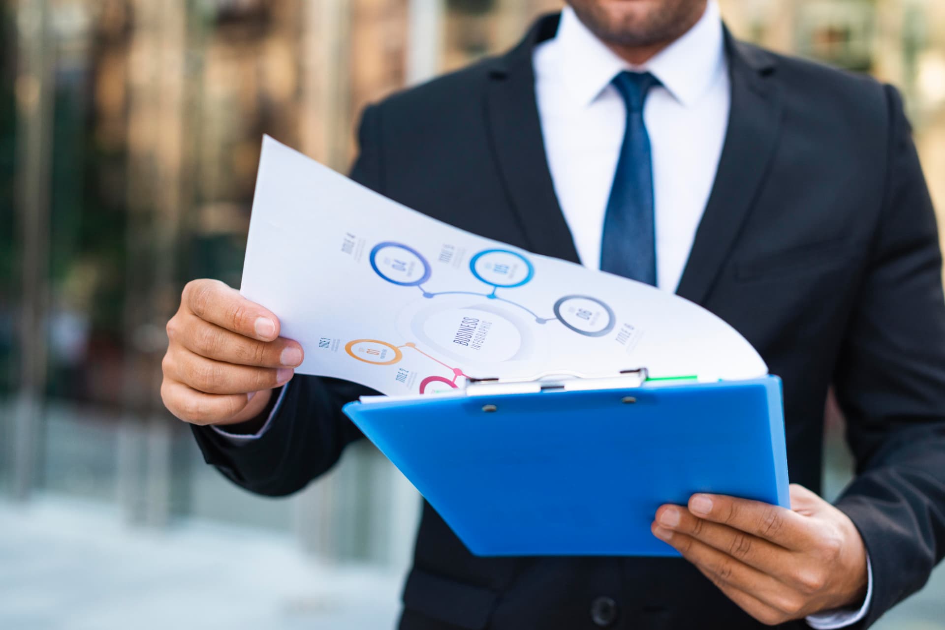 Manager reviewing performance reports on a clipboard